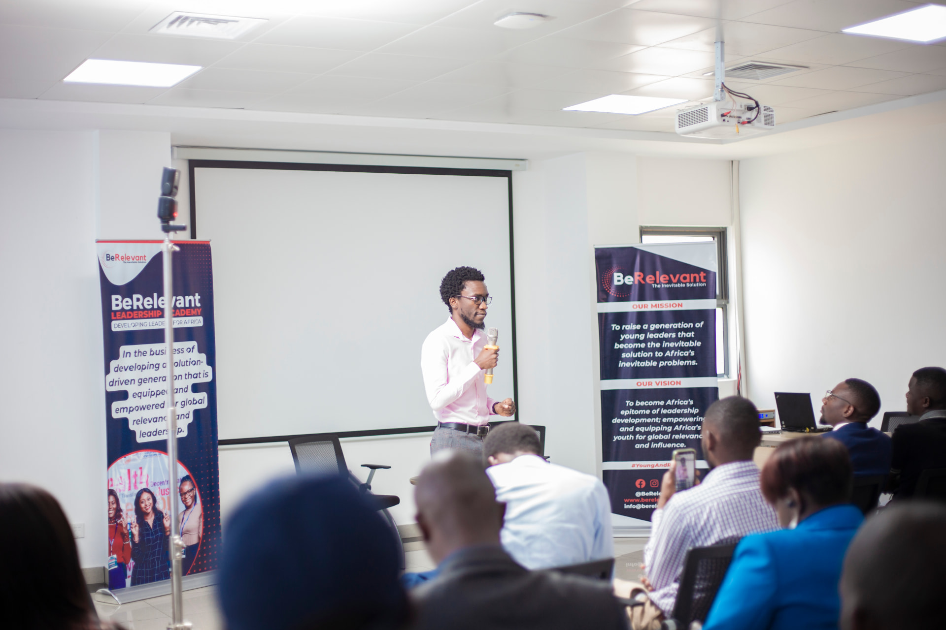 Shuko Musemangezhi presenting to an audience
