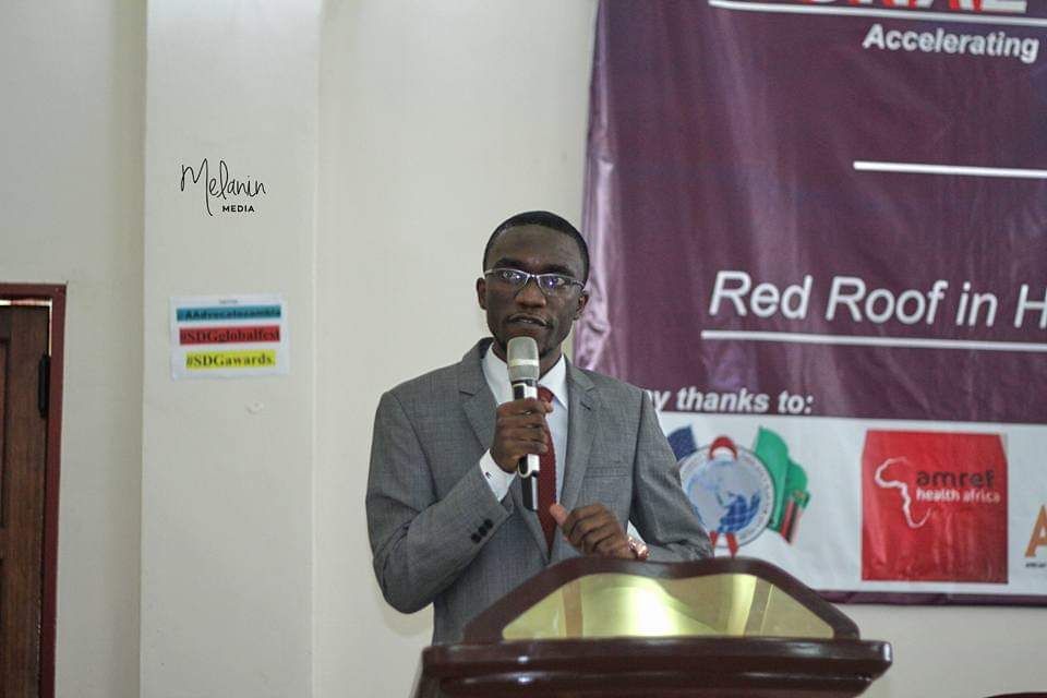 Shuko Musemangezhi addressing an audience from a podium